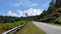 Federal Route 4, East-West Highway shot with mountain top and jungle